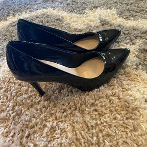 Nine West shinny black heels. Worn only twice